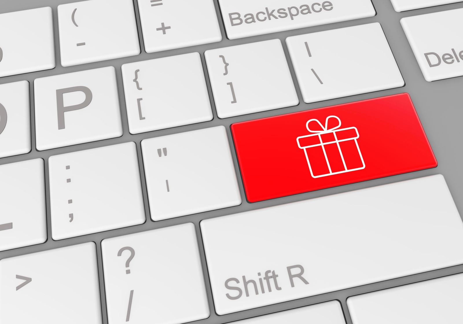 clavier d'ordinateur avec touche rouge symbolisant un cadeau
